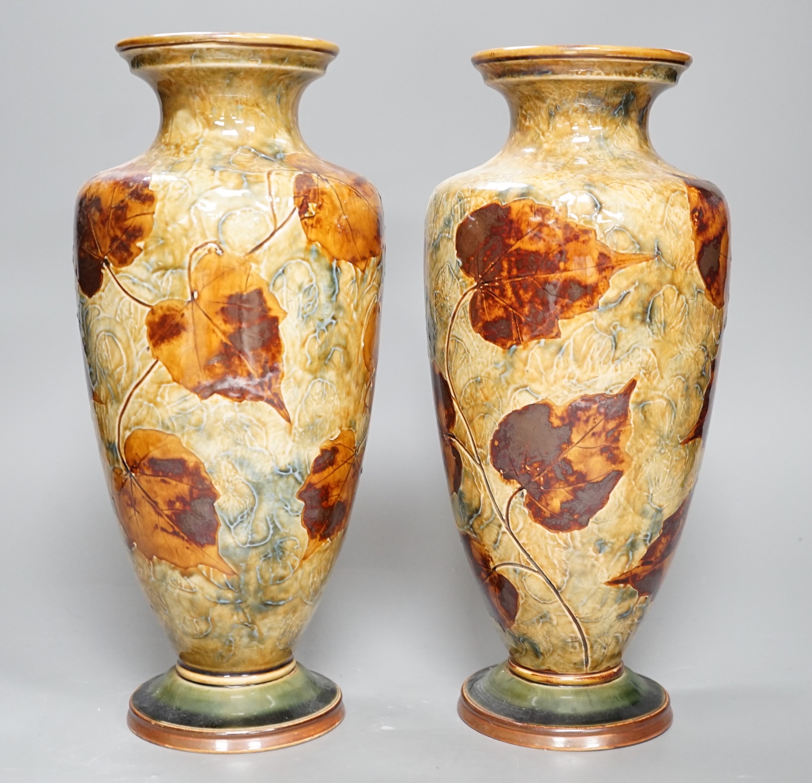 A pair of Doulton stoneware leaf pattern vases, c.1930, 31cm